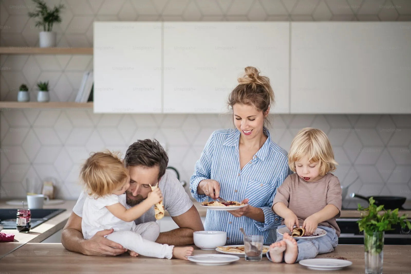 A family together in a bright kitchen