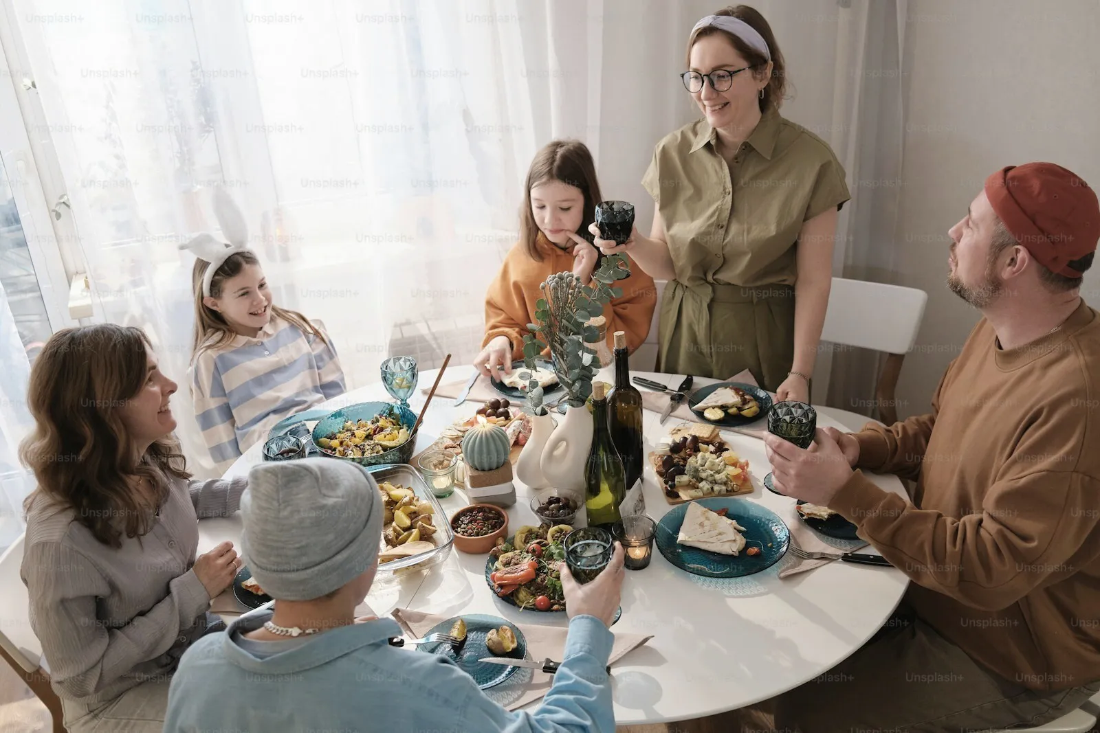 A busy family meal around a full table