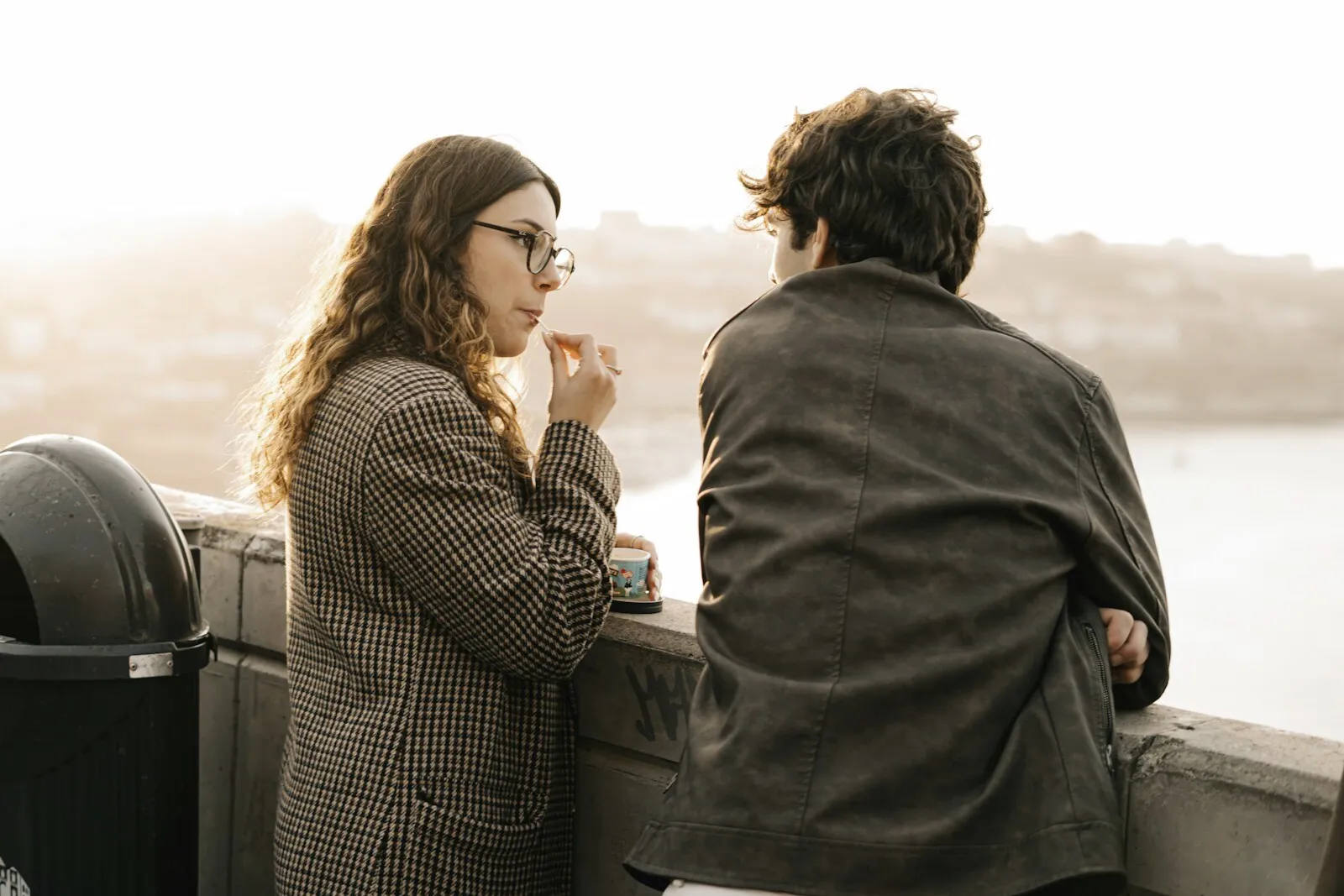 A couple talking honestly while looking out together