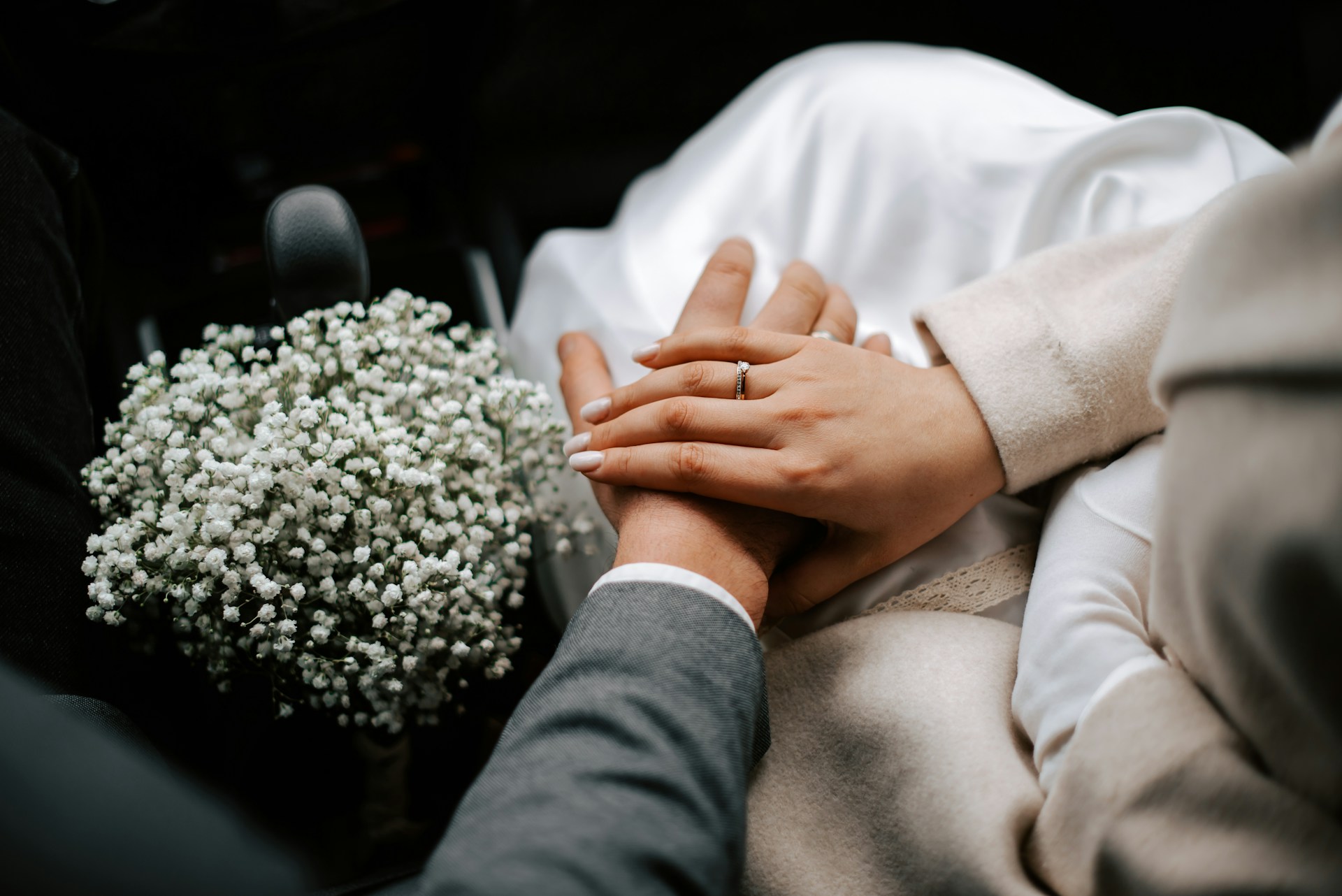 A couple sitting close together, smiling and reconnecting