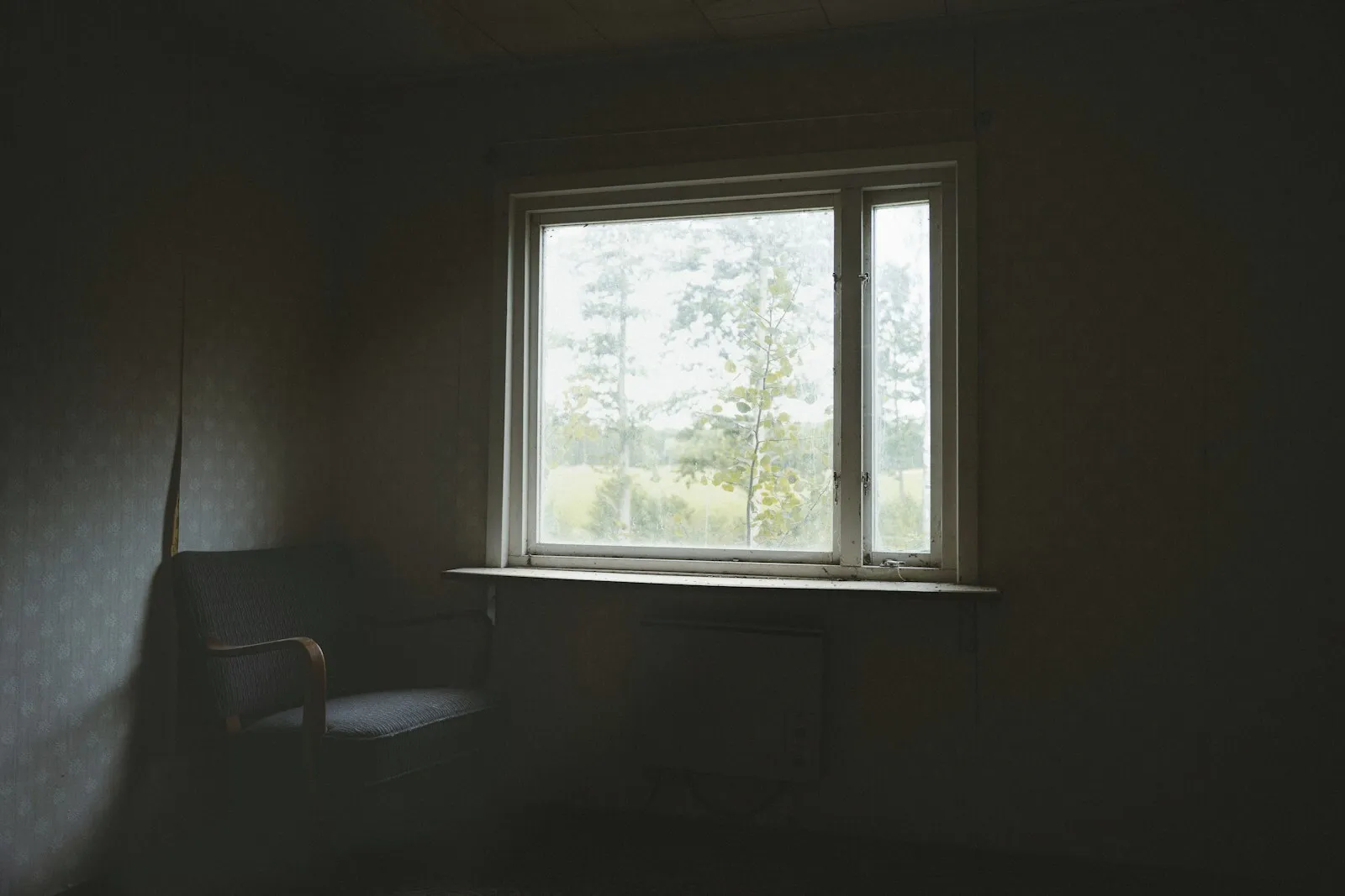 Soft daylight through a window in a quiet, empty room