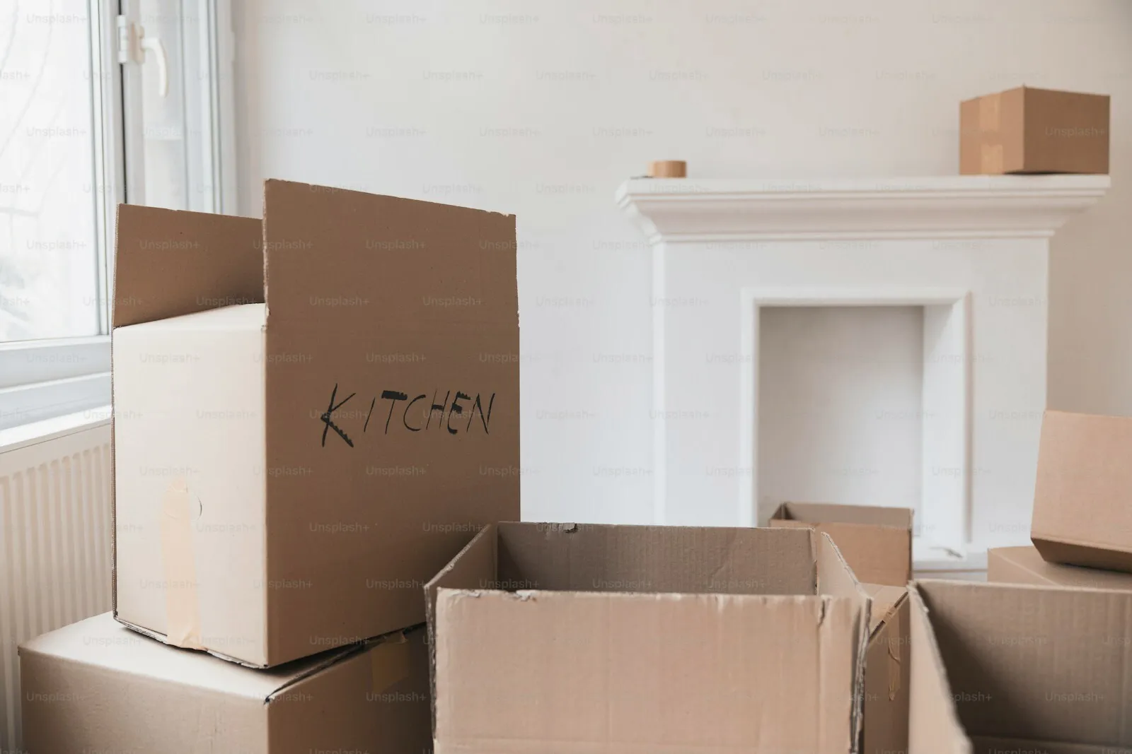 Packing boxes waiting in a half-empty room