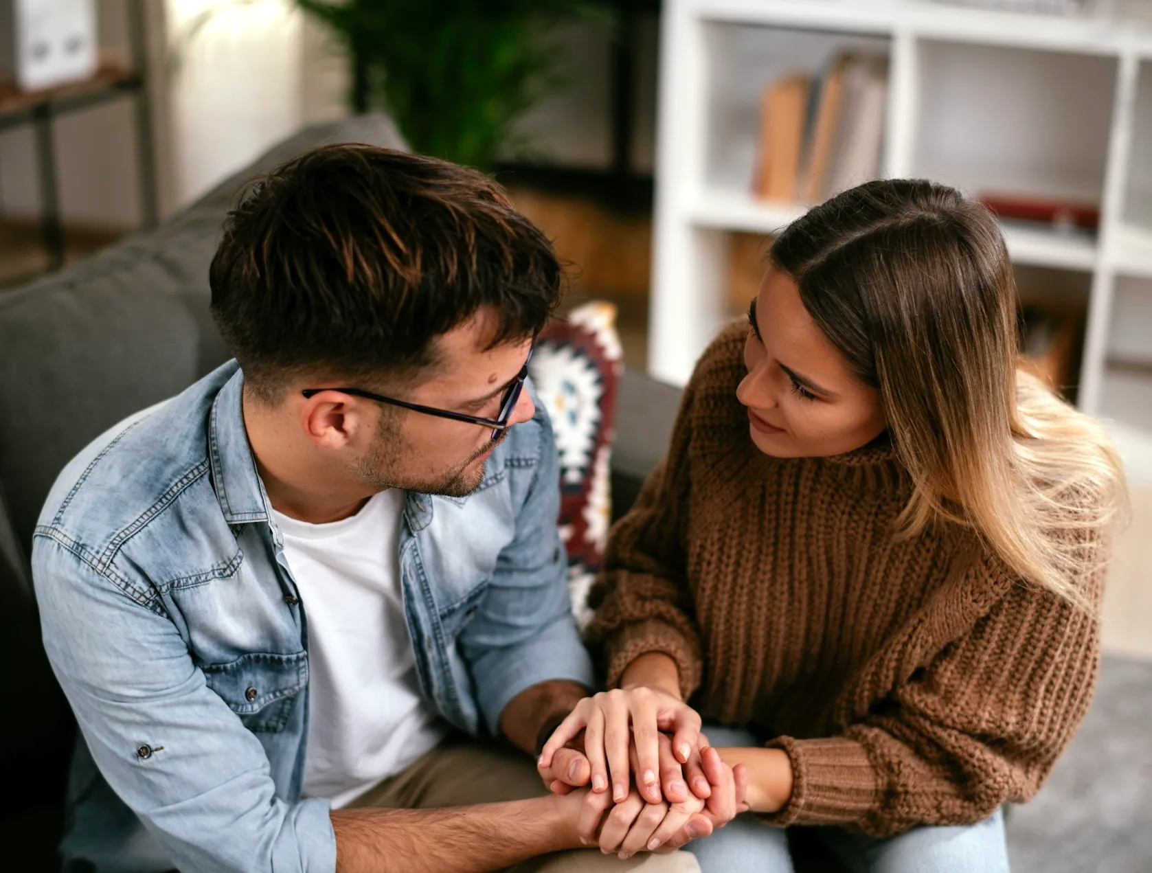 A couple sitting together in conversation during a therapy session